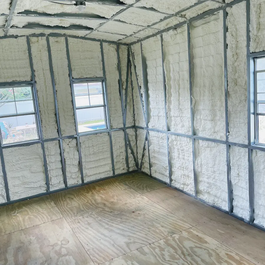 Closed-cell spray foam insulation applied to wall cavities in a residential project in Sayre